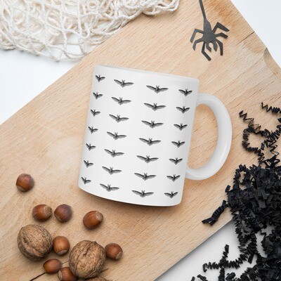 A Batty White glossy mug