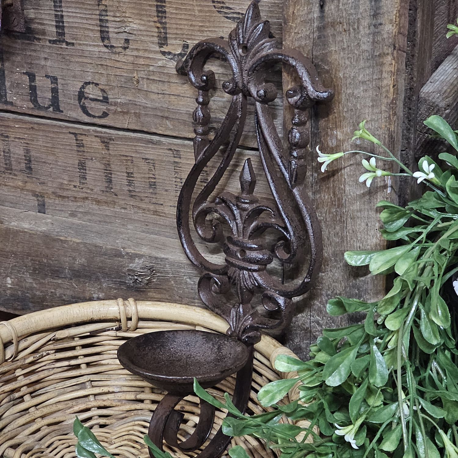 Cast iron wall mounted candle holder