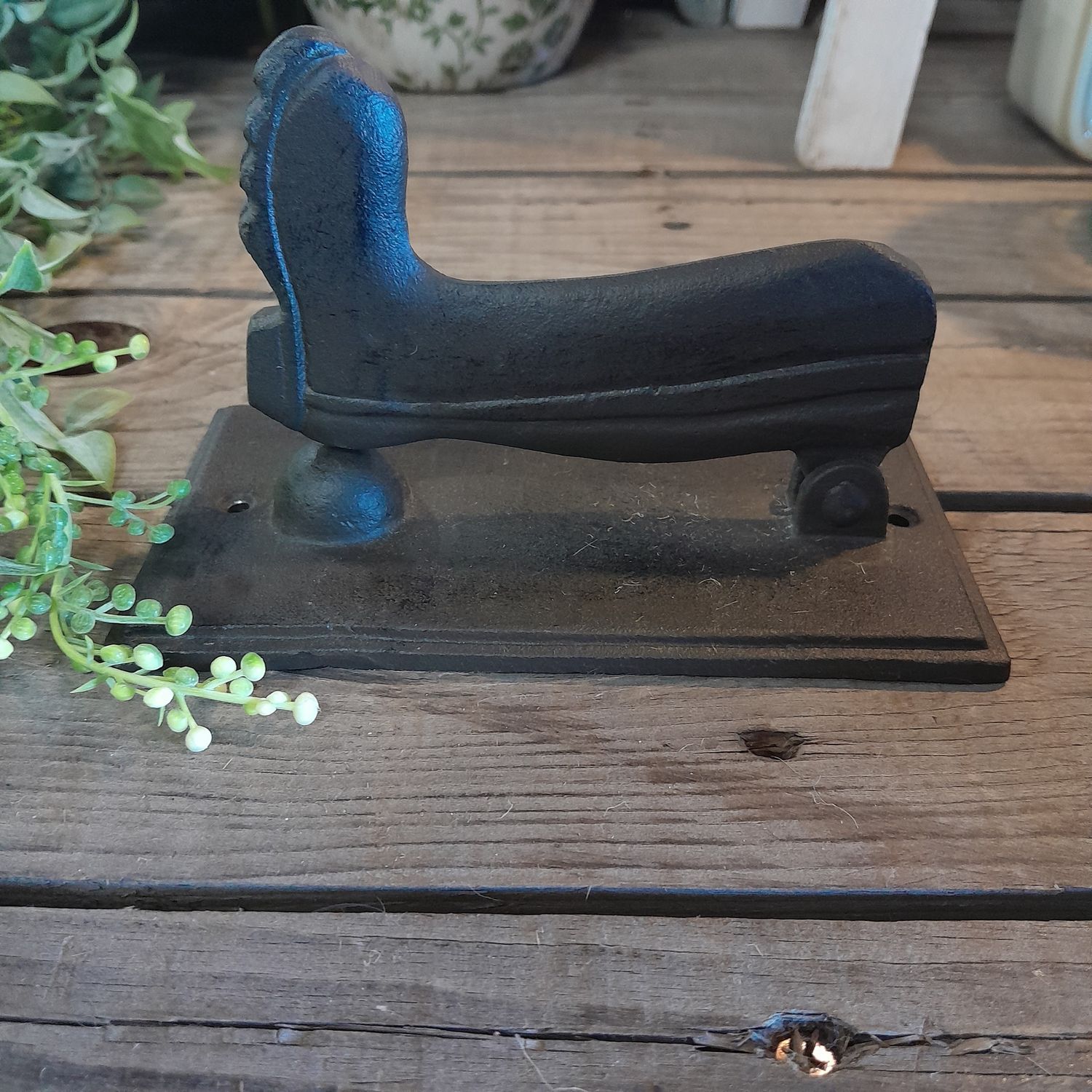 Cast iron gum boot door knocker