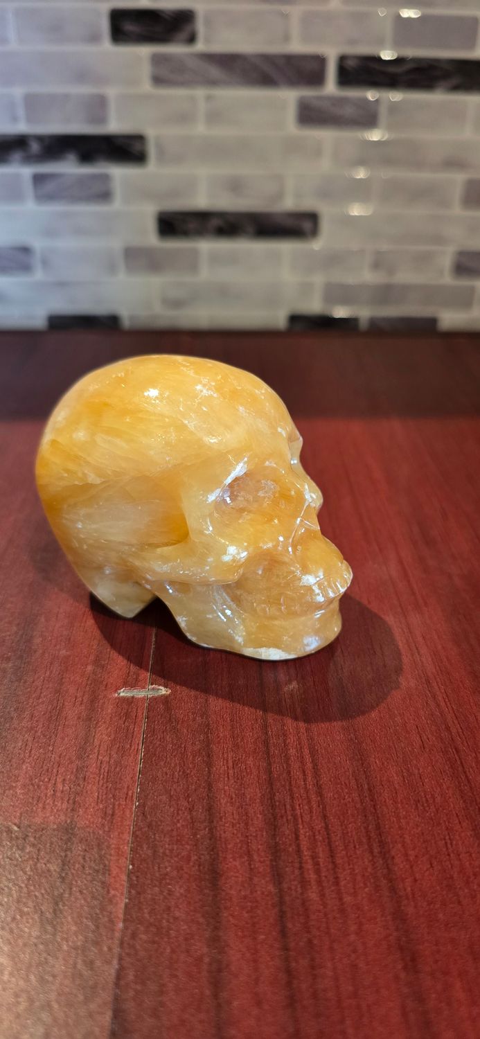 Orange Calcite Skull – 0.366kg