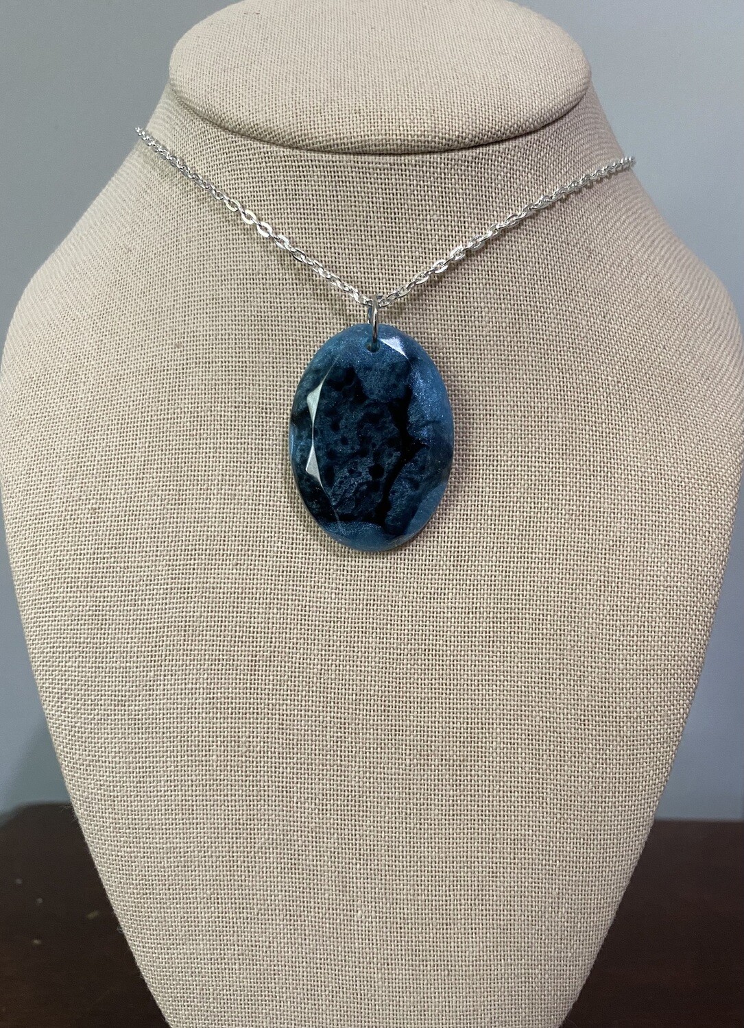 Blue and Black Oval