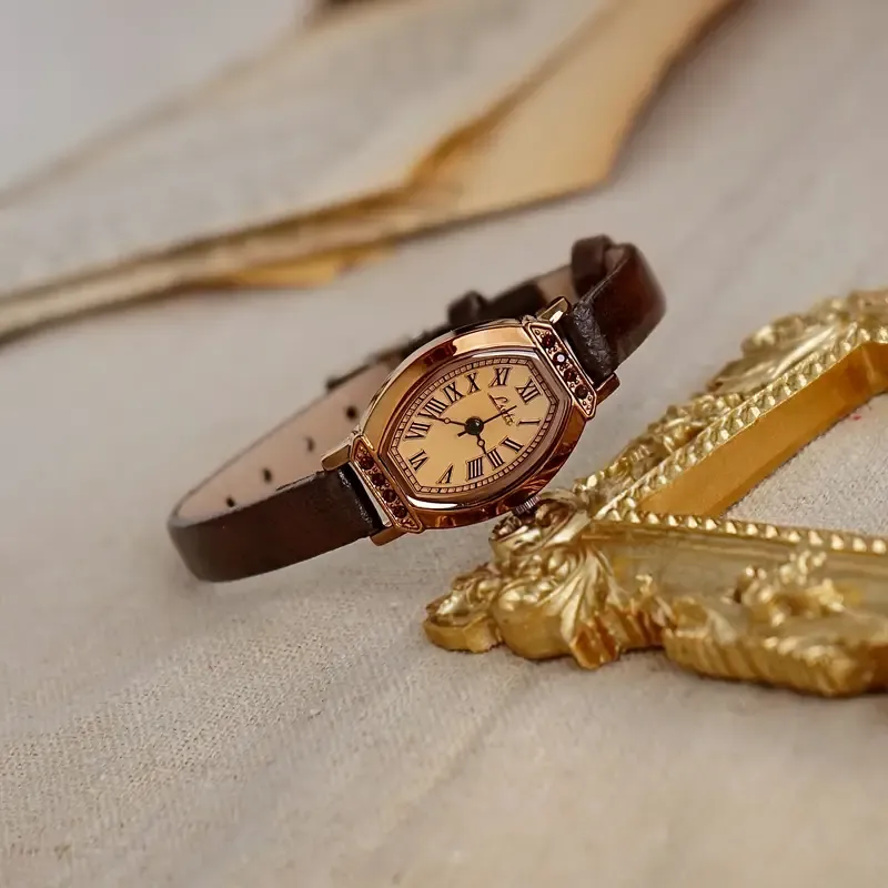 A Vintage Chic Casual Elegant Women&#39;S Coffee Brown Faux Leather Belt Watch with a Stylish And Delicate Barrel-Shaped Small Dial Adorned with Rhinestones.