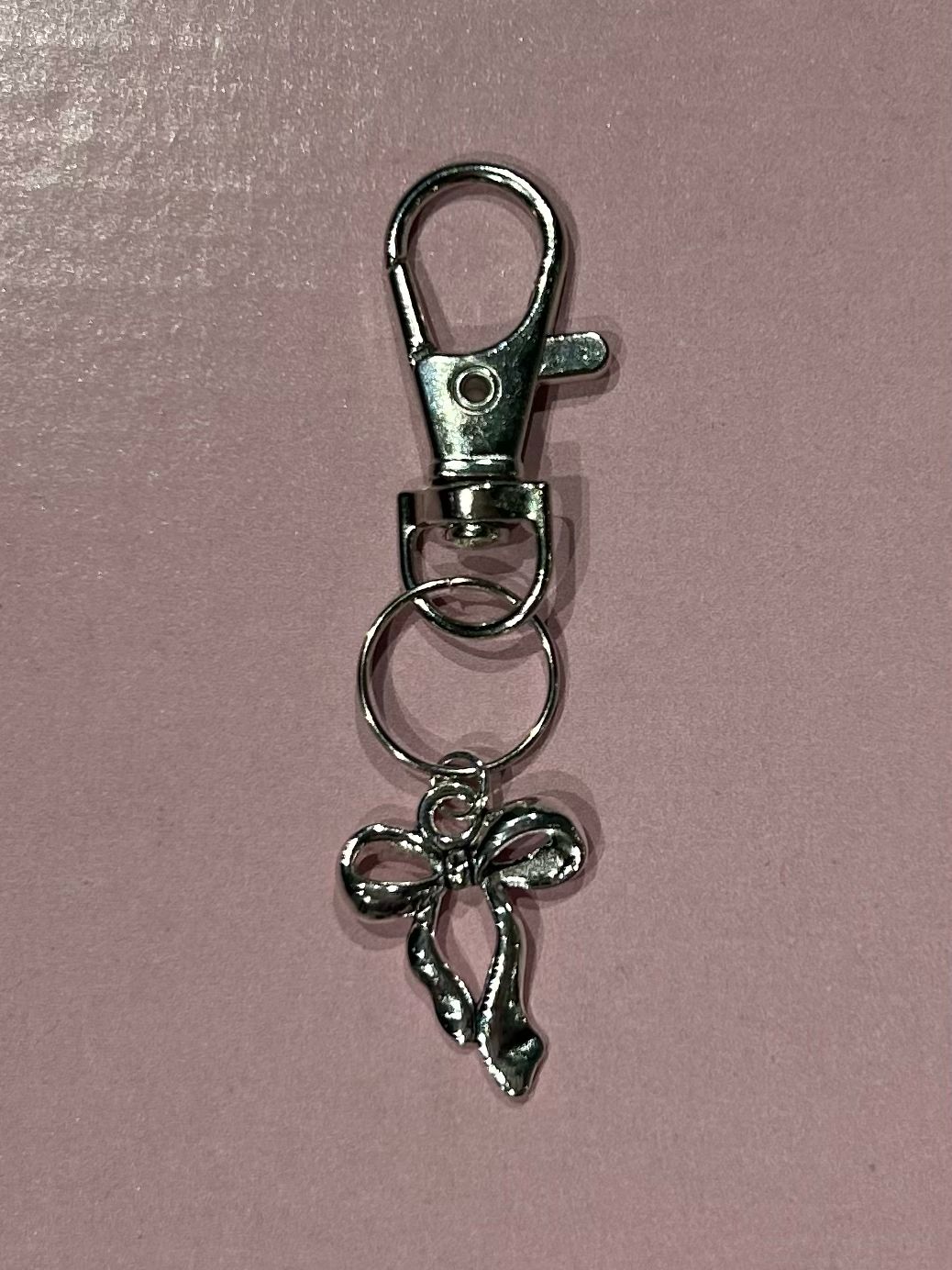 Silver bow charm