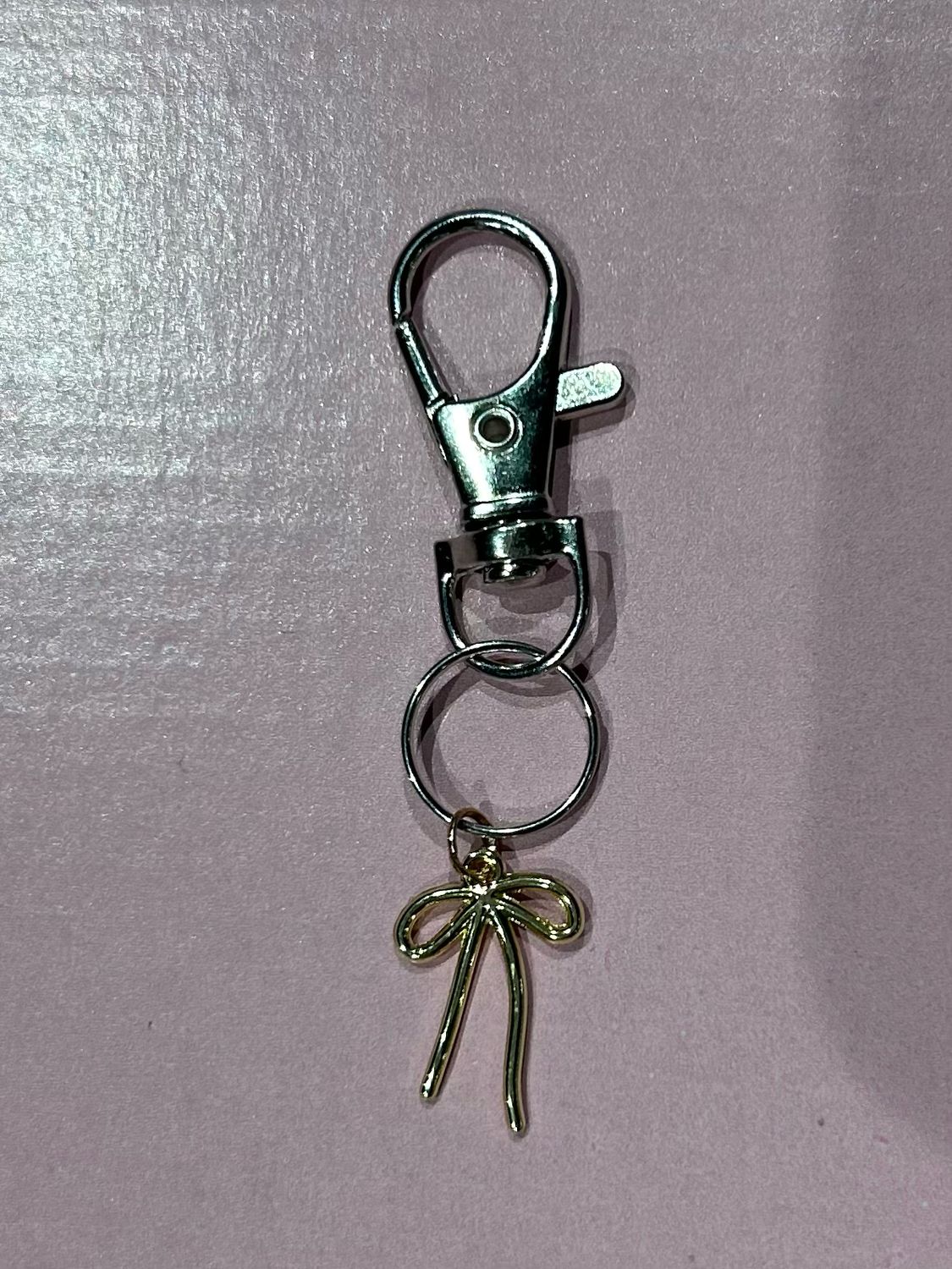 Gold bow charm
