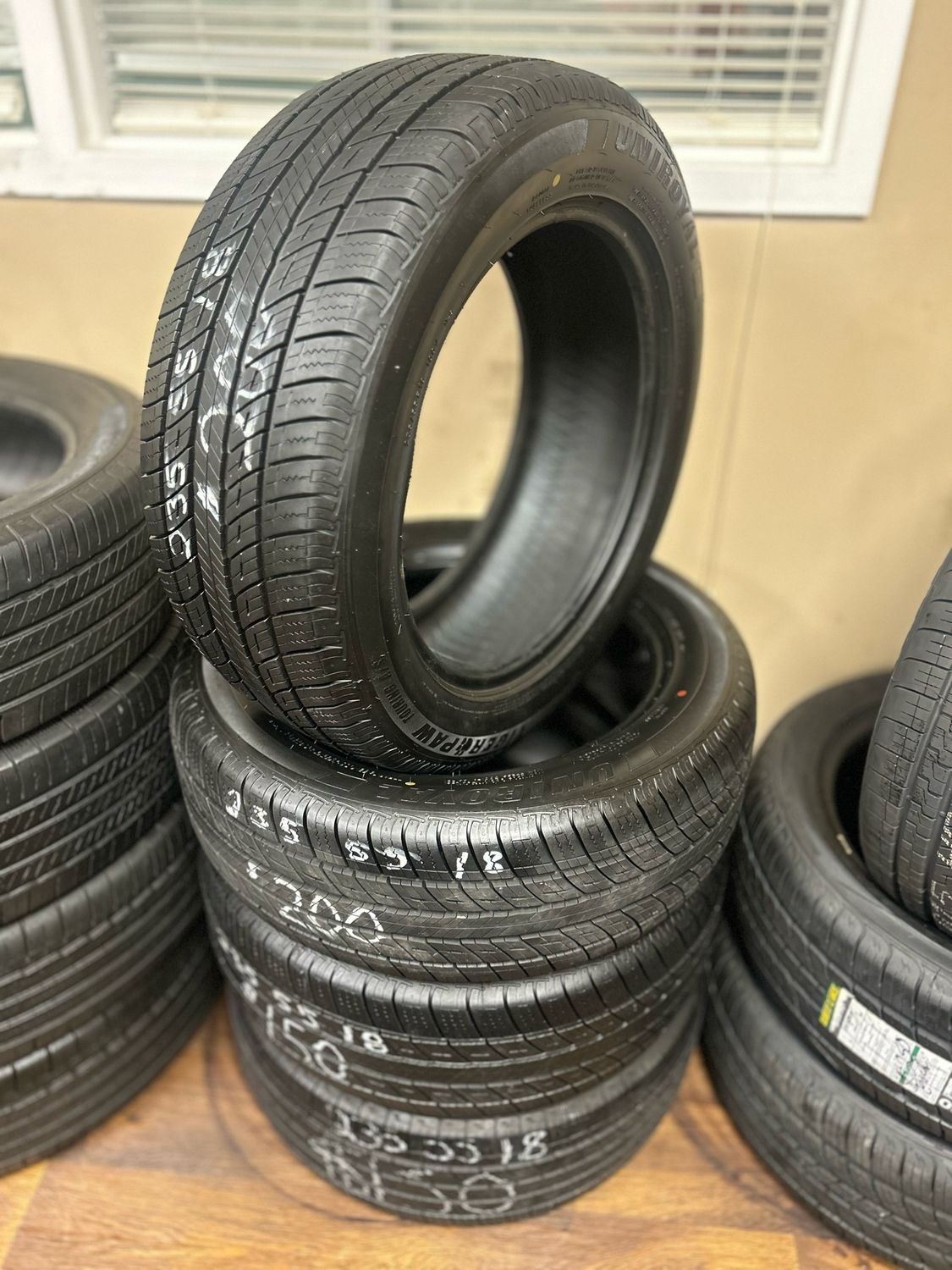 SET OF 4 USED HIGH TREAD 2355518 UNIROYAL TIGERPAW TOURING A/S DT 100V 9.5/32NDS