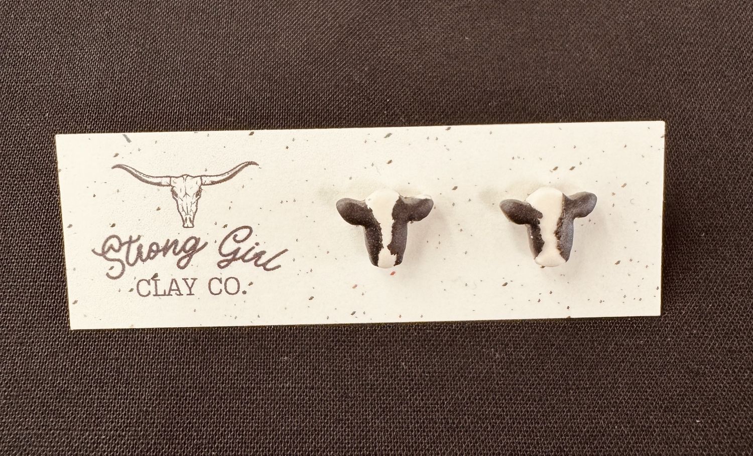 STRONG GIRL CLAY CO. BLACK &amp; WHITE COW HEAD STUDS