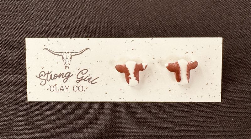 STRONG GIRL CLAY CO. BROWN &amp; WHITE COW HEAD STUDS