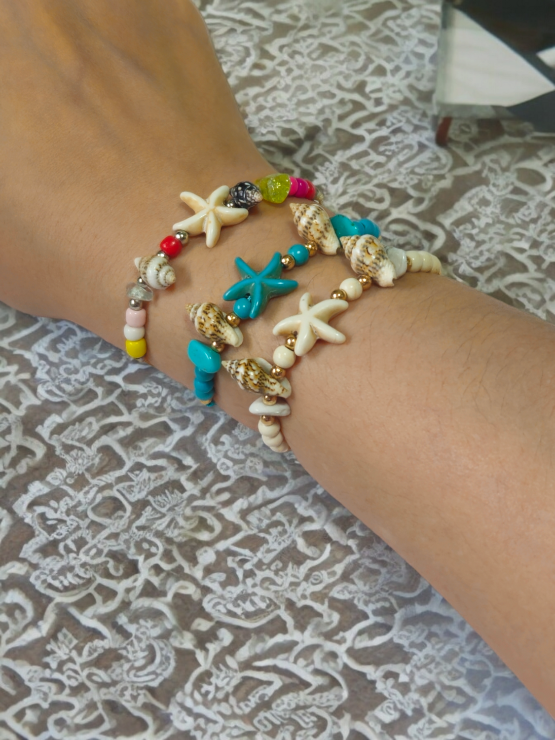 Handmade adjustable beaded shell and starfish friendship bracelet/anklet.