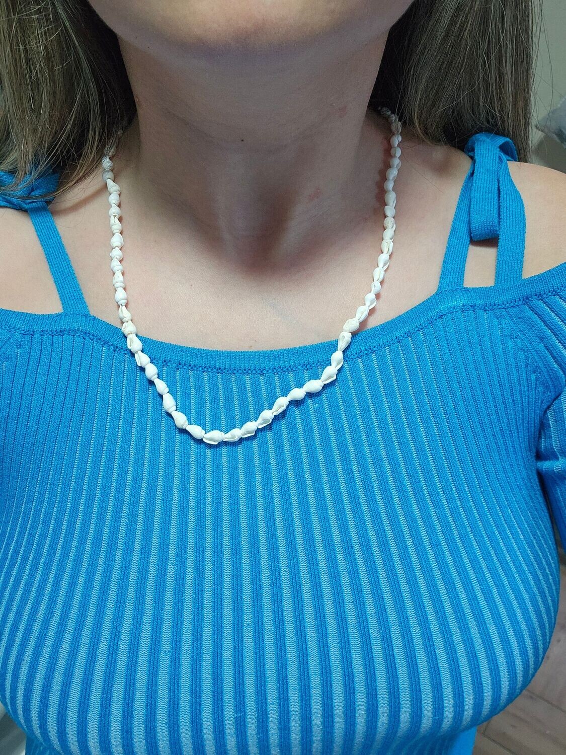 Handmade beaded shell necklace.