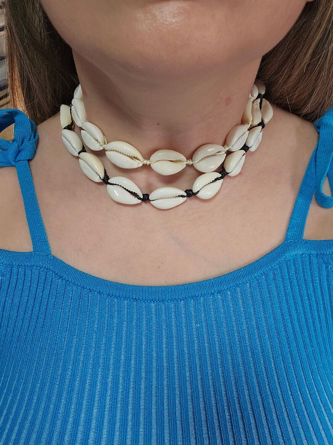 Handmade adjustable macramé cowrie shell choker.