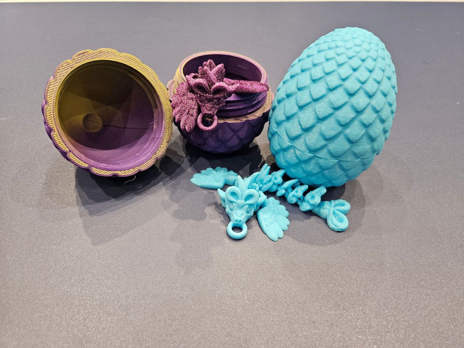 3D printed dragon egg with a flexible mini dragon keychain