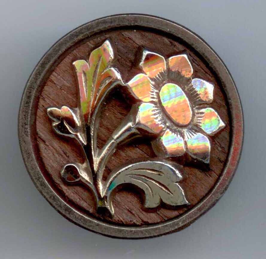 Steel Cup with Steel Flower on Wood Background