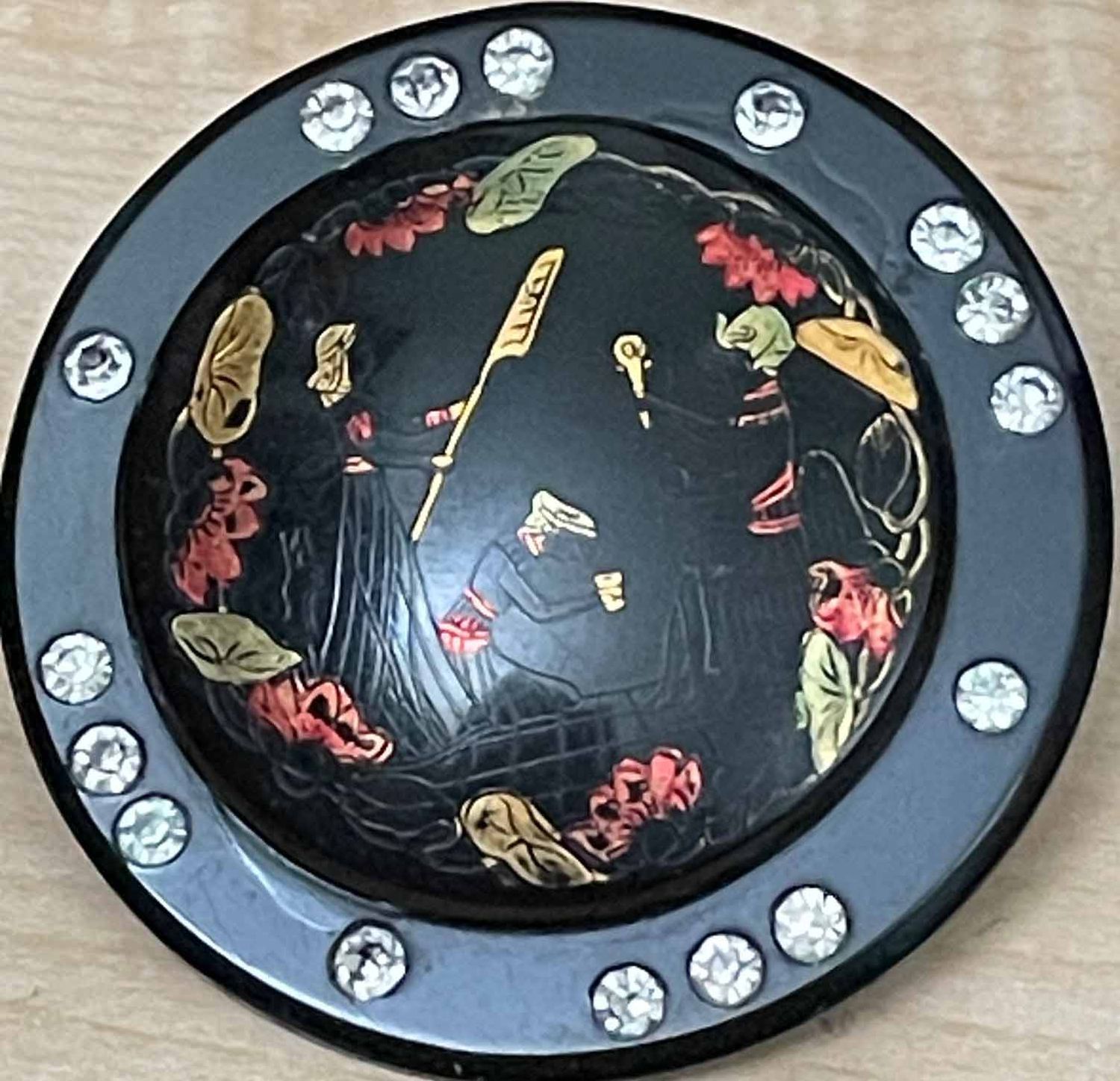 Three People Etched into Celluloid, Rhinestone Border