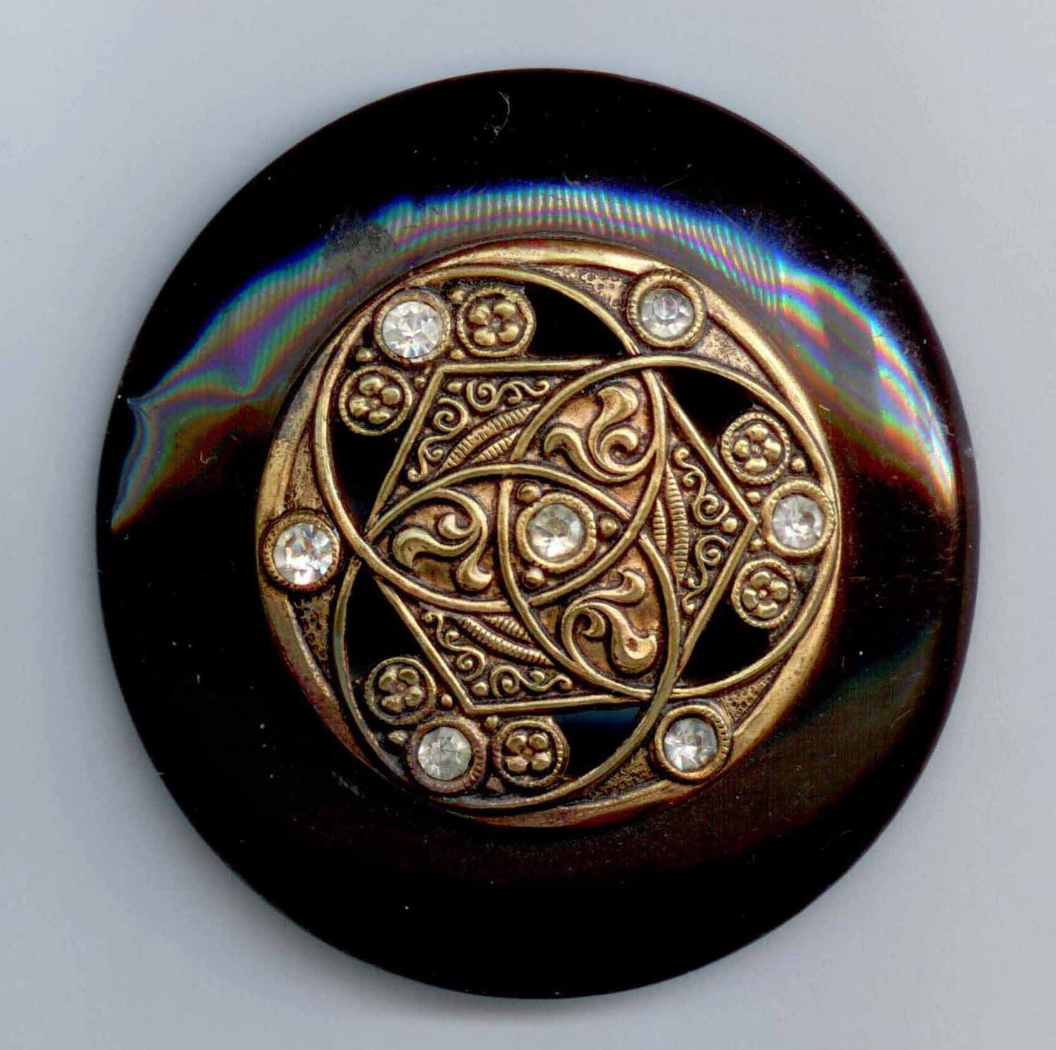 Celluloid with 2 shanks near edge