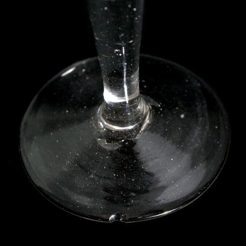 Tall toasting glass with pierced air beads, England, 1st half of the 18th century.