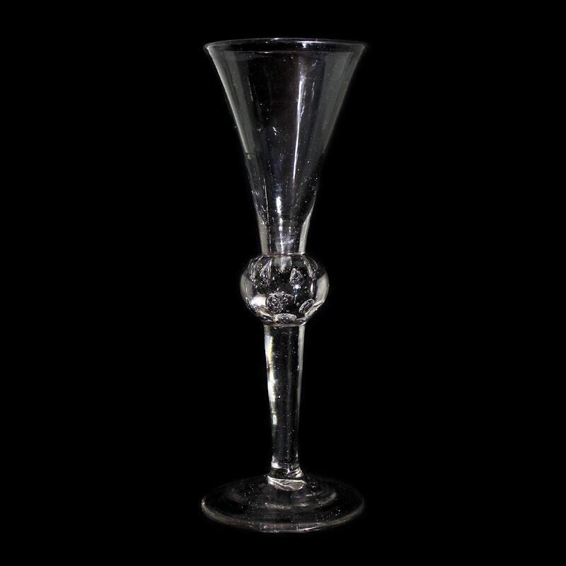 Tall toasting glass with pierced air beads, England, 1st half of the 18th century.