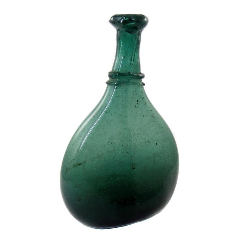 Bocksbeutel, flat bottle made of green glass, Persia 19th century.