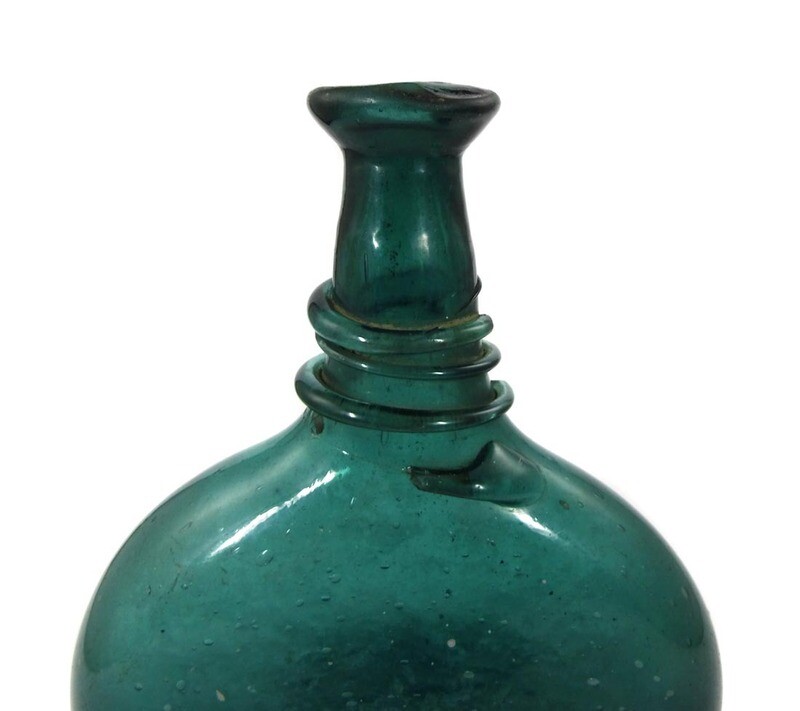 Bocksbeutel, flat bottle made of green glass, Persia 18th century.