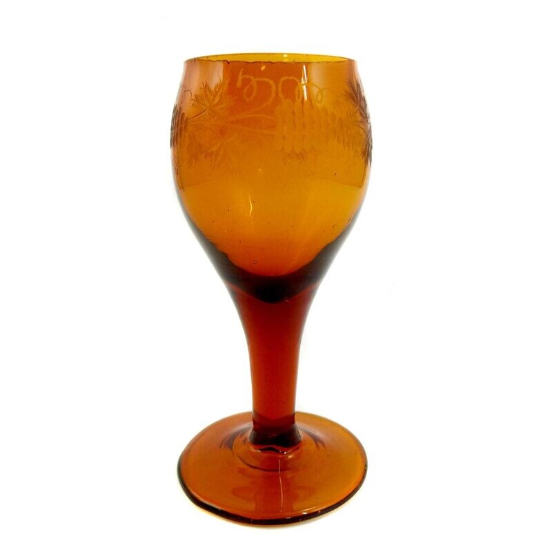 Amber-colored goblet with cut decoration, early 19th century.
​