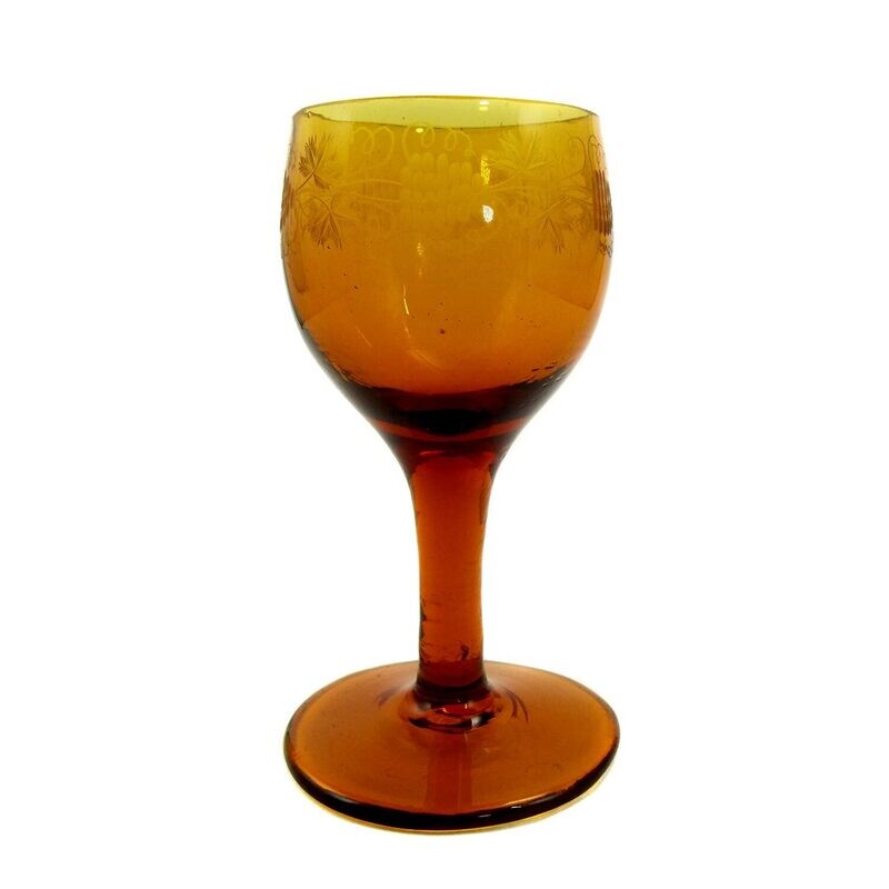 Amber-colored goblet with cut decoration, early 19th century.
​
