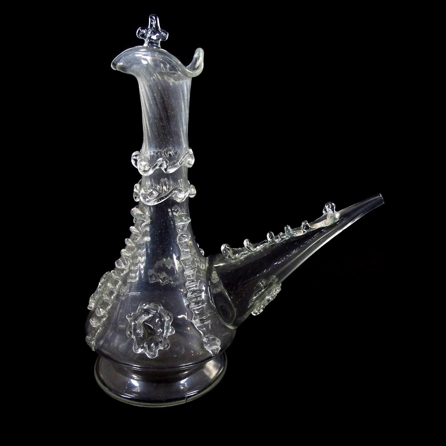 Porron / drinking bottle made of colorless glass with pinched thread supports