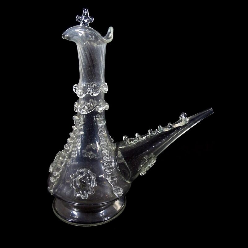 Porron / drinking bottle made of colorless glass with pinched thread supports