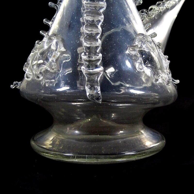 Porron / drinking bottle made of colorless glass with pinched thread supports