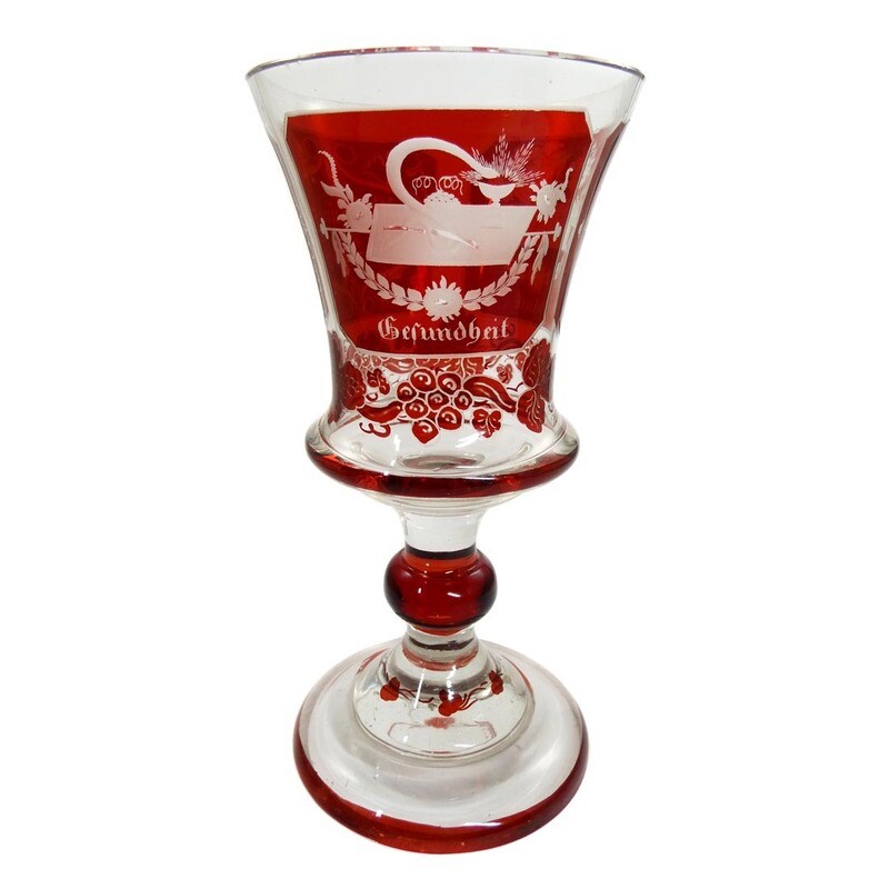 Biedermeier cup glazed ruby red with engraved symbols of good luck around 1850