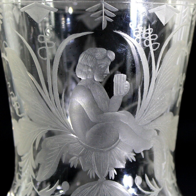 Footed cup made of colorless glass with engraved youth, Steinschönau