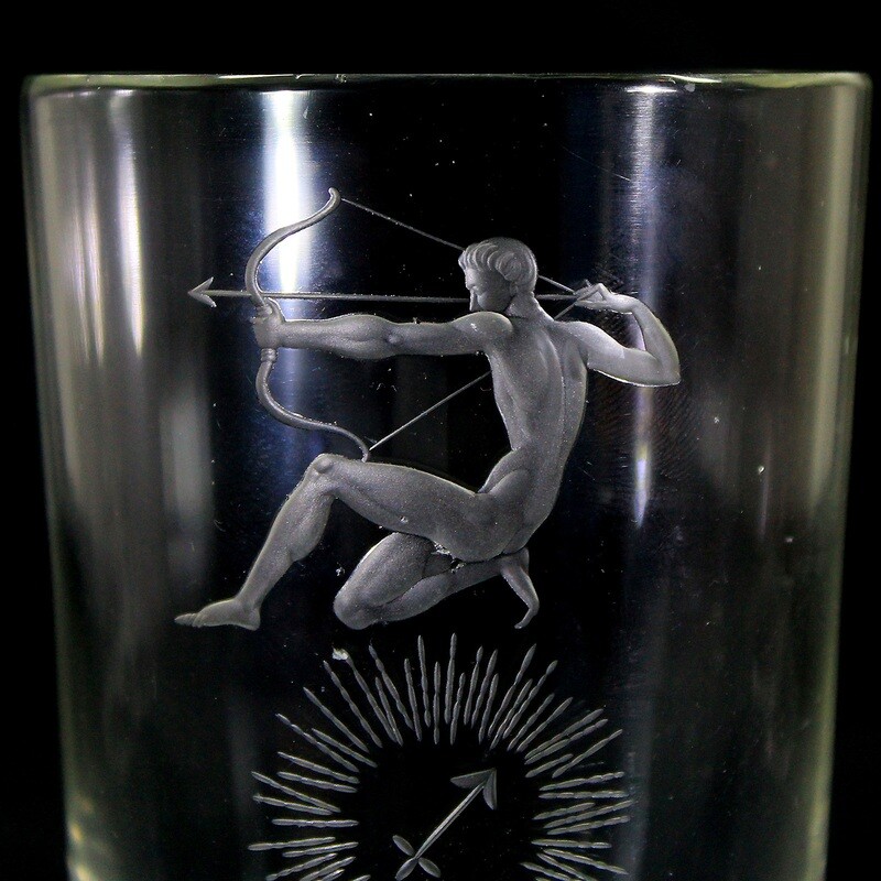 Cup made of colorless glass with the zodiac sign Sagittarius, Steinschönau around 1938