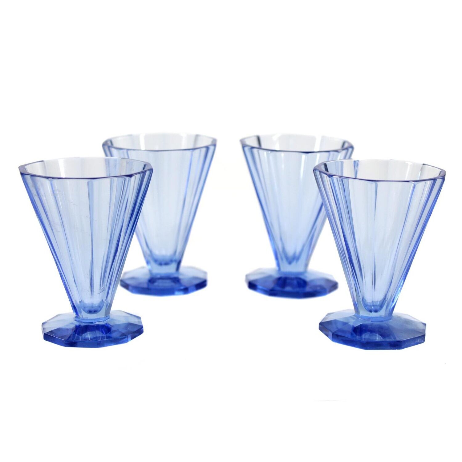 4 liqueur shot glasses made of light blue, multi-faceted glass, Czechoslovakia
