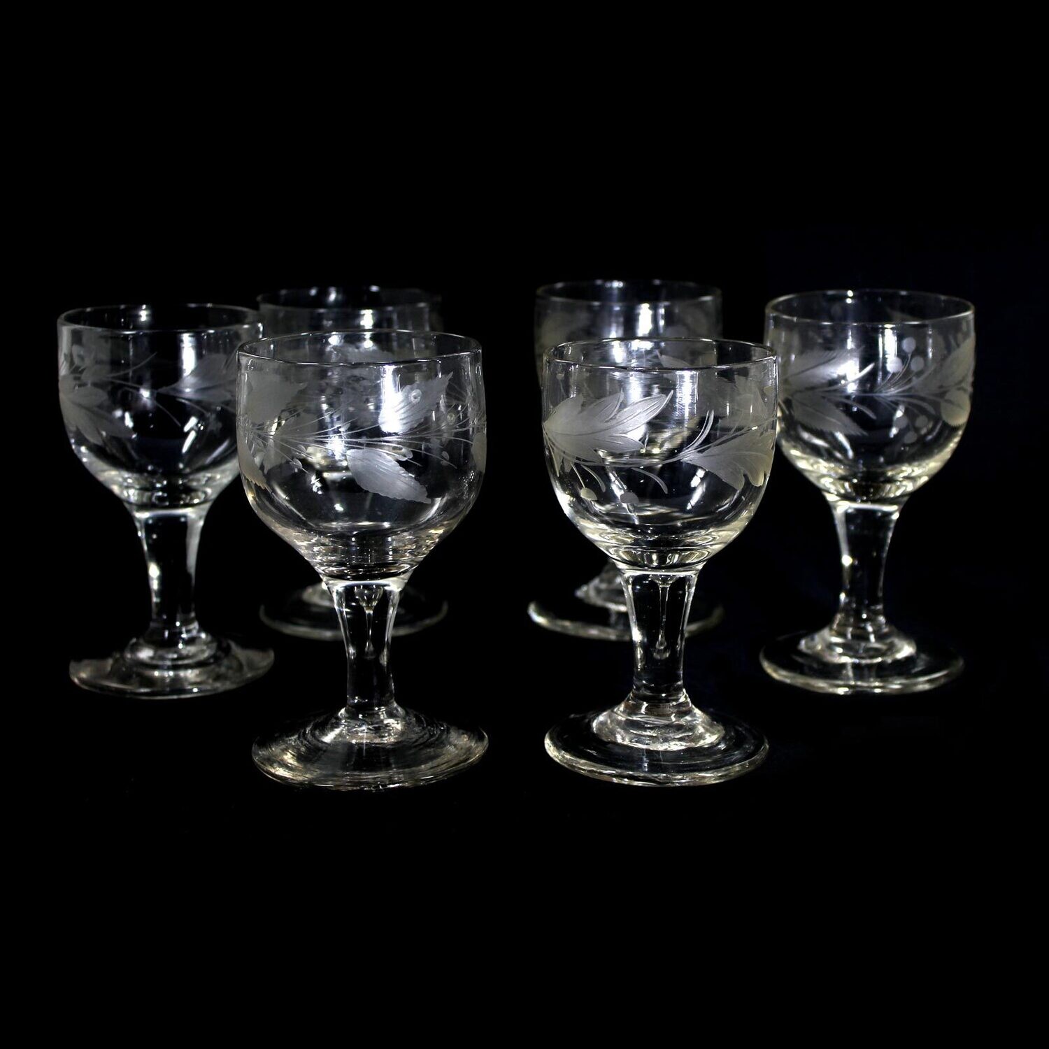 6 goblet glasses made of colorless glass with engraved leaf border, Schleswig around 1820