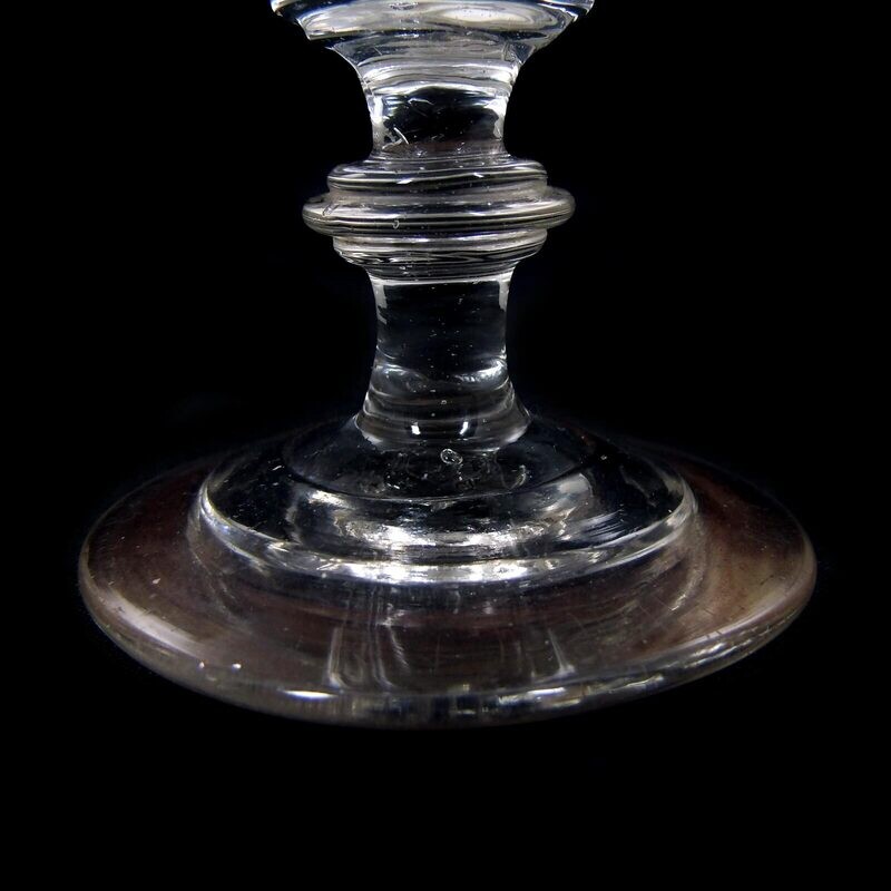Goblet glass made of colorless glass with triple disc mode, North German 1st edition. 19th century