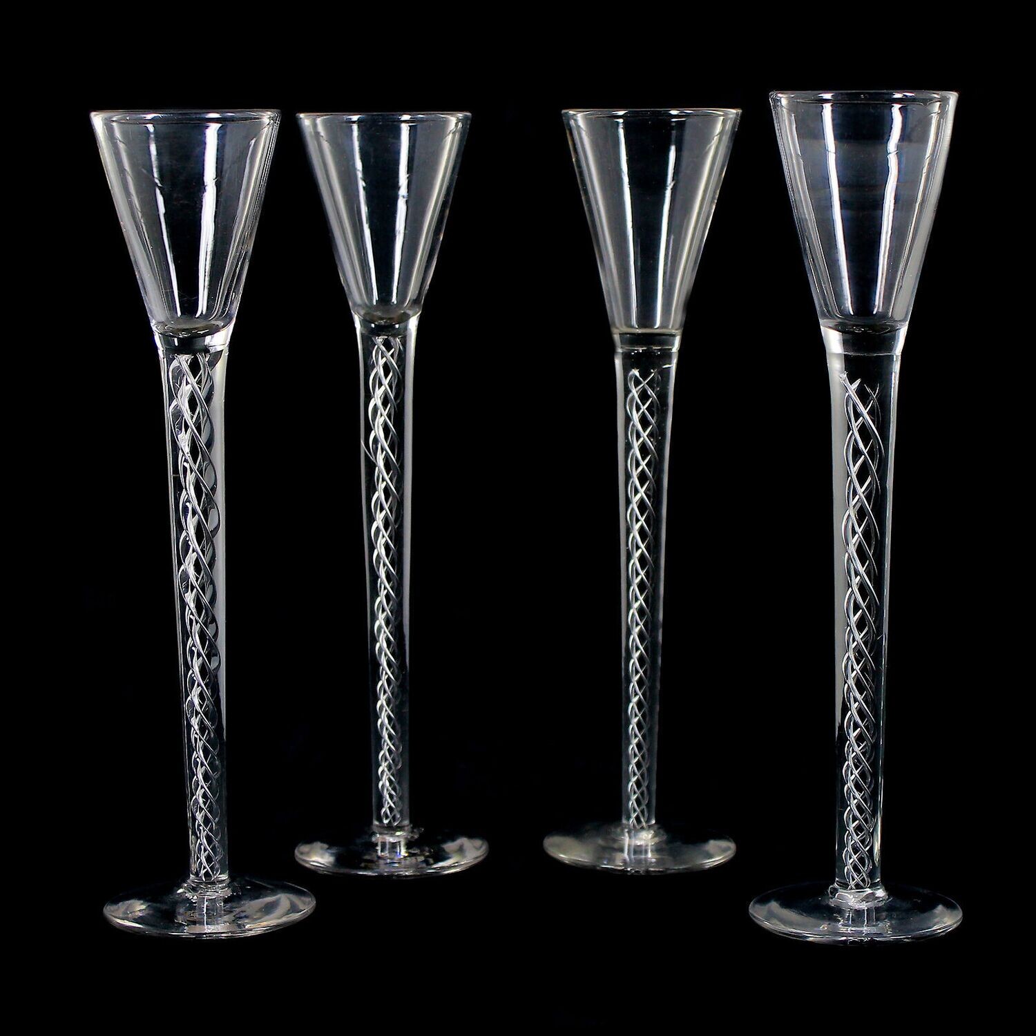 1st of 4. Tall English thread glass with air filigree, early 19th century.