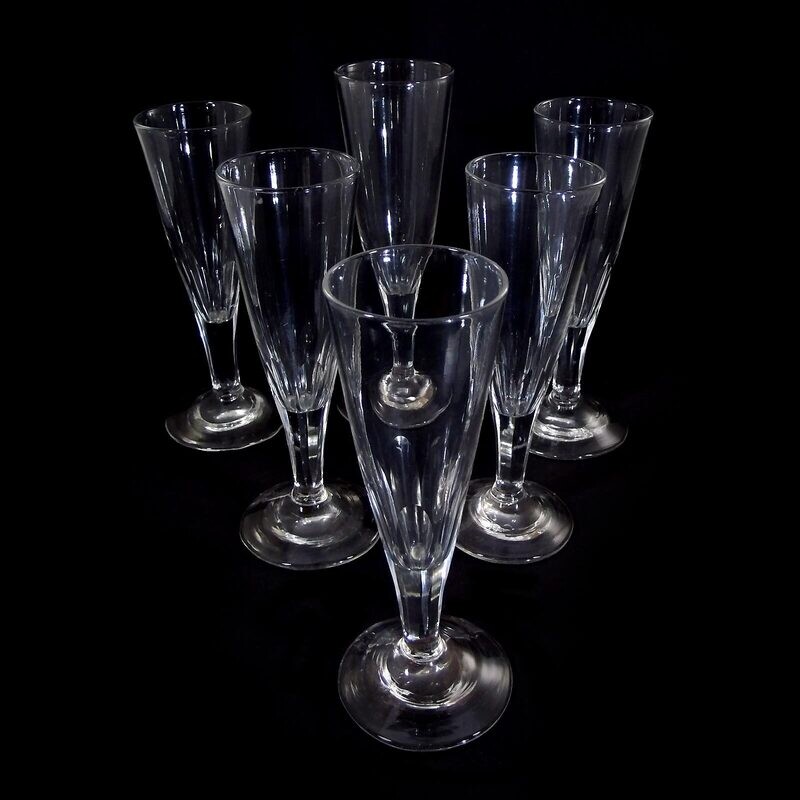 6 champagne flutes made of colorless glass with a 7-fold peeled shaft, North German