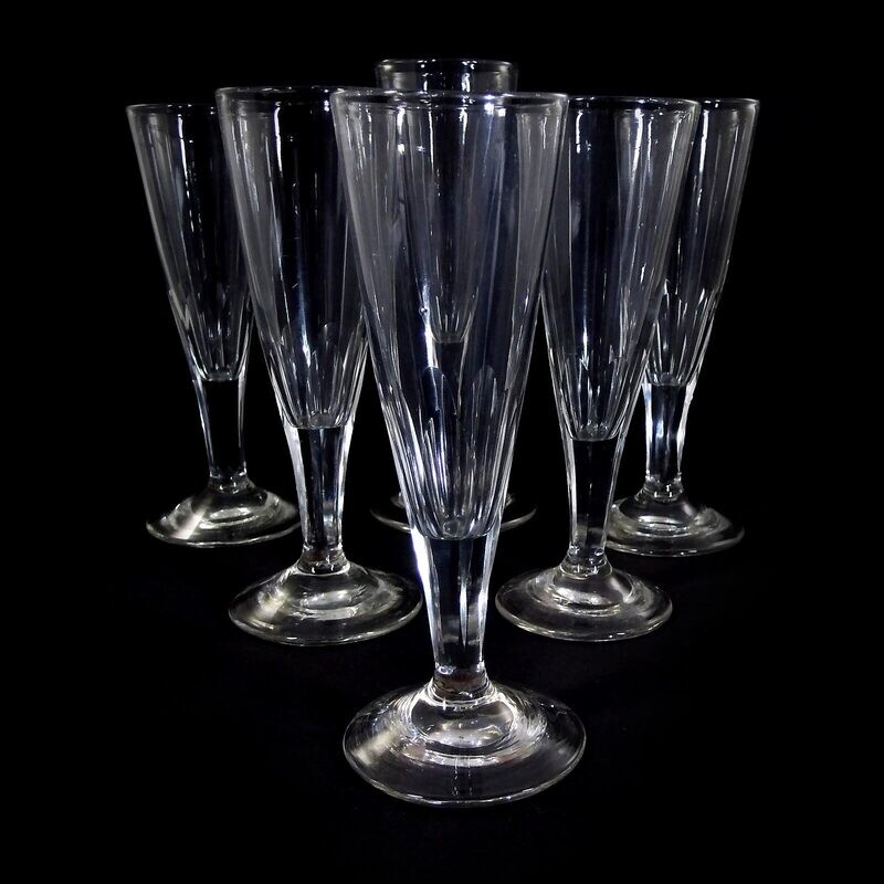 6 champagne flutes made of colorless glass with a 7-fold peeled shaft, North German