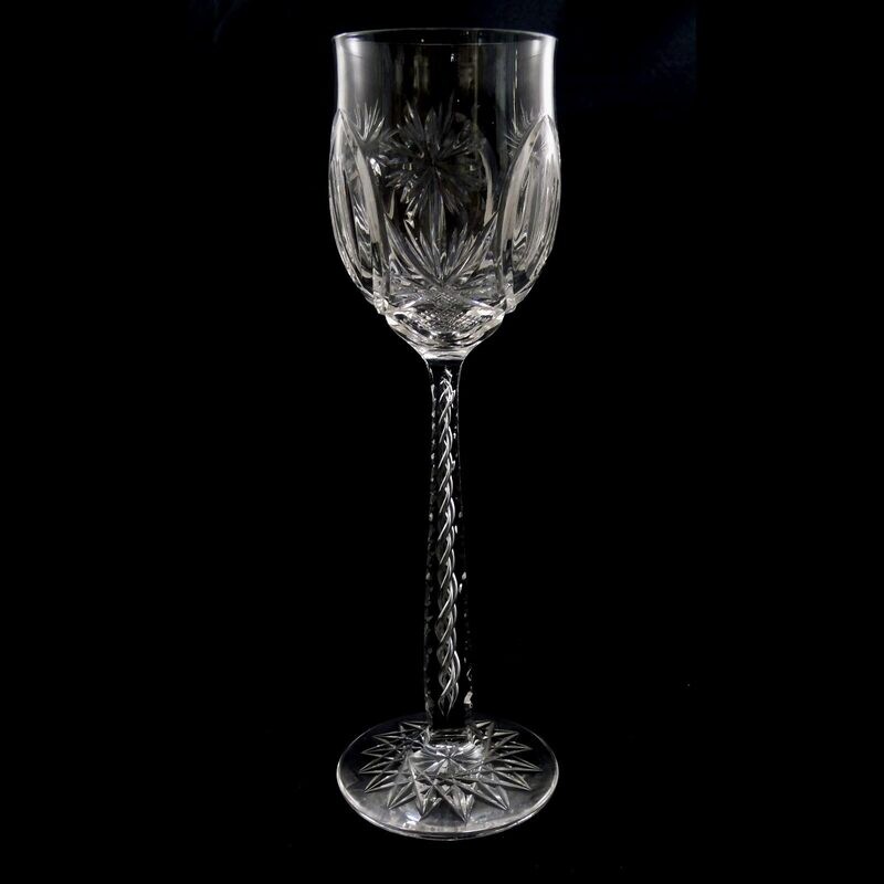 1. of 4. Tall stemmed glass made of colorless crystal glass with air filigree around 1915