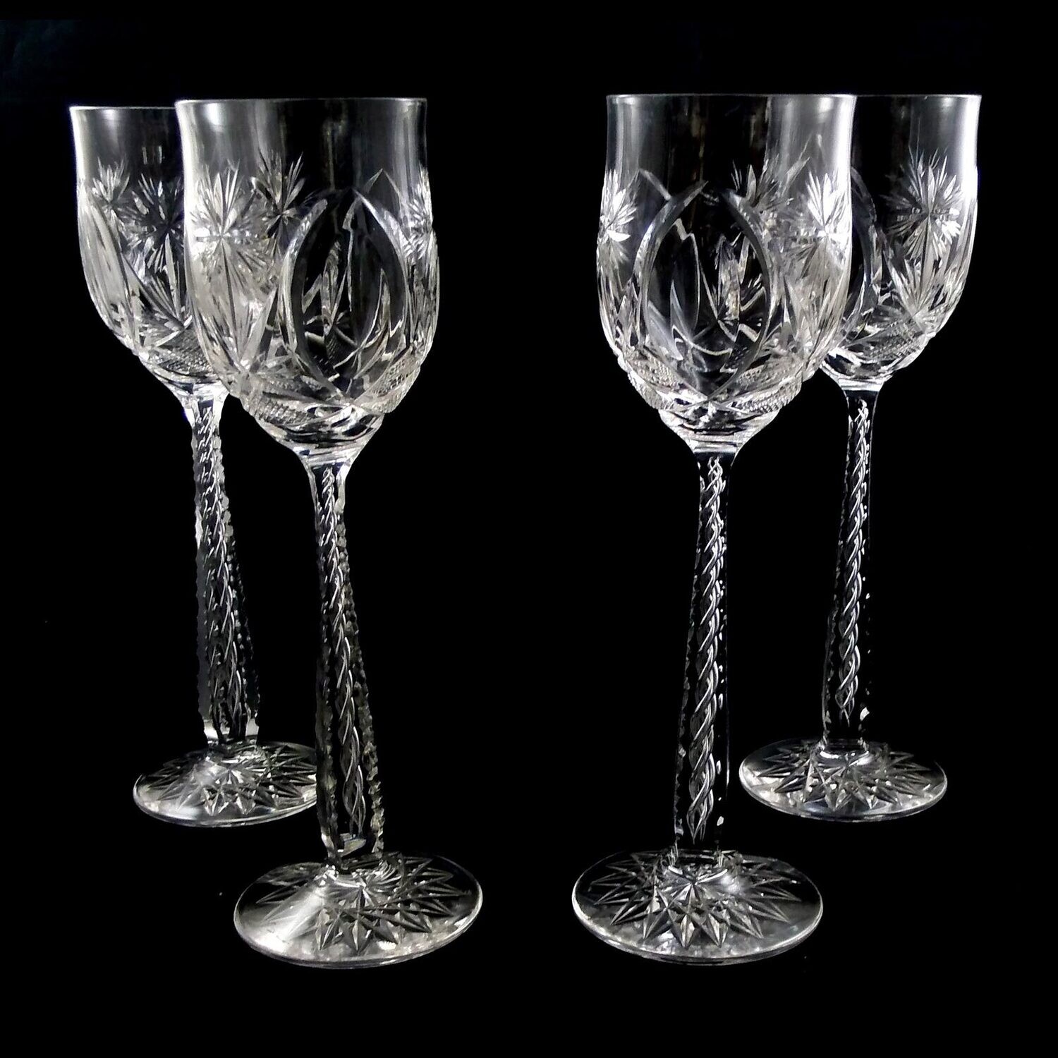 1. of 4. Tall stemmed glass made of colorless crystal glass with air filigree around 1915