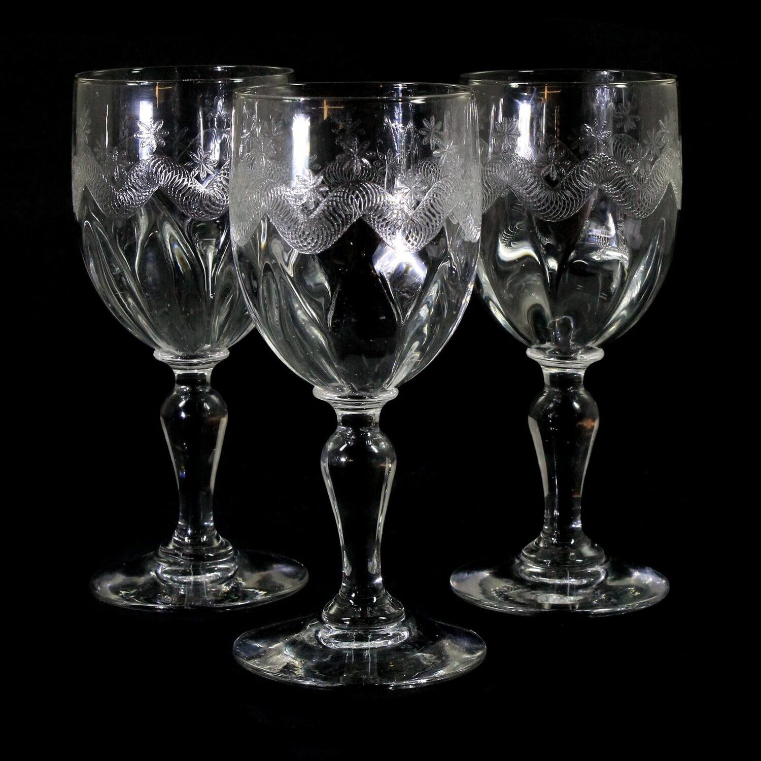 3 stem glasses made of colorless glass with guilloche decoration, Portieux