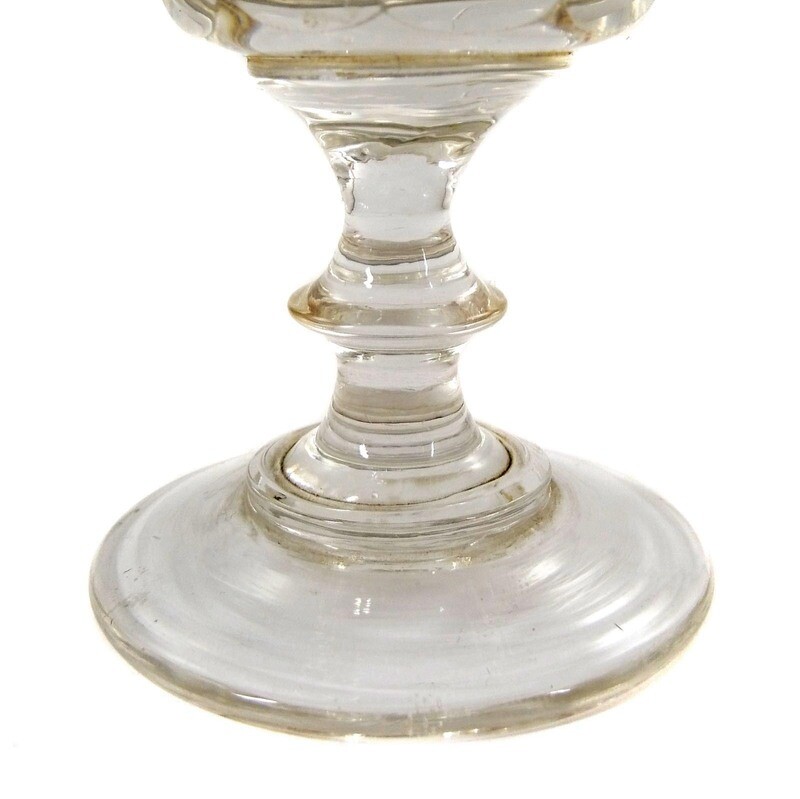 Goblet glass made of colorless glass with arched facets, pressed nodus, mid-19th century.