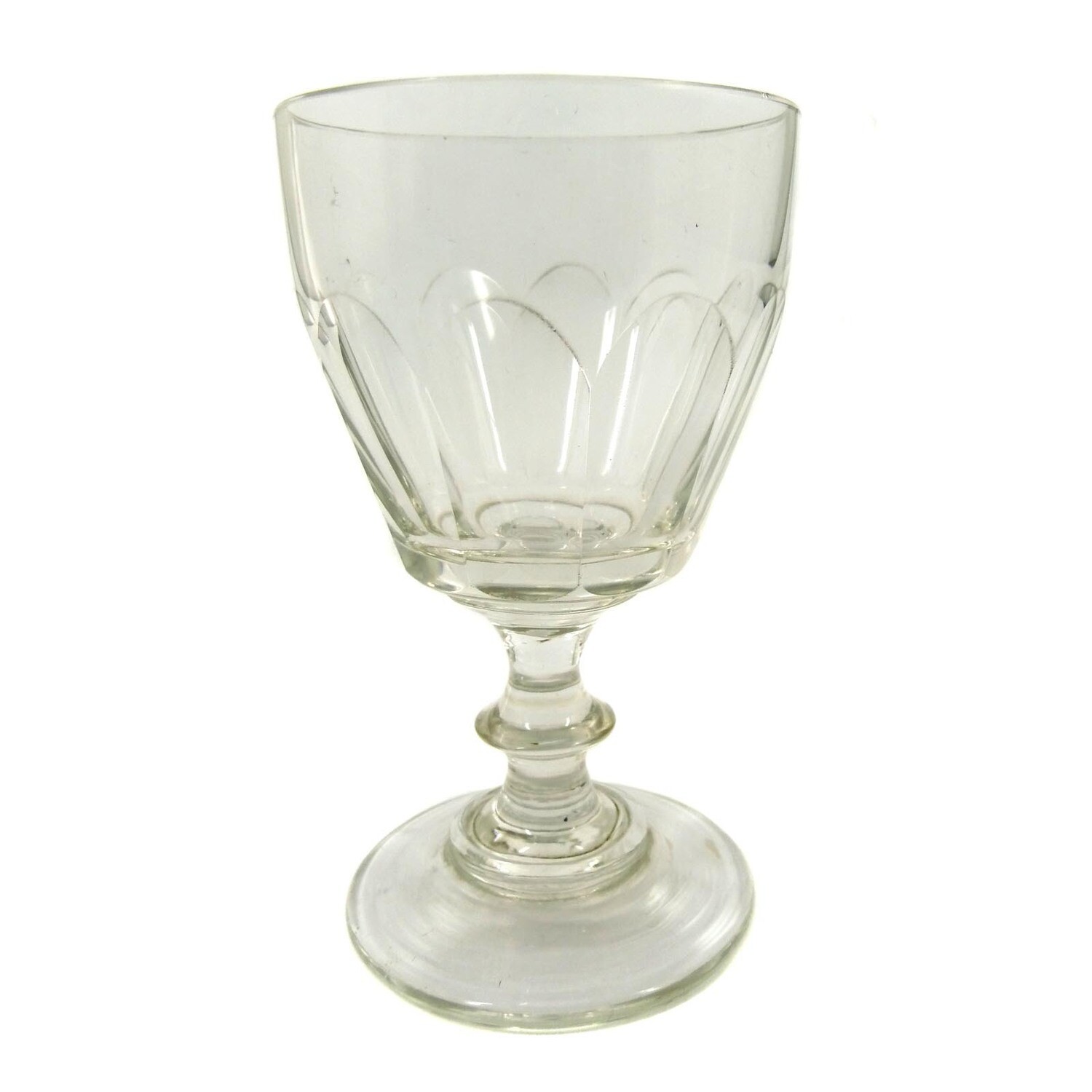 Goblet glass made of colorless glass with arched facets, pressed nodus, mid-19th century.