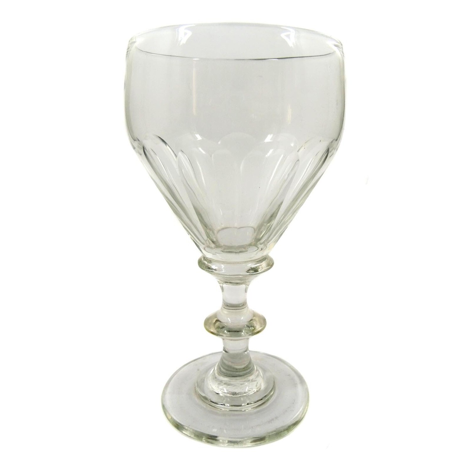 Goblet glass made of colorless glass with arched facets, pressed nodus, mid-19th century.