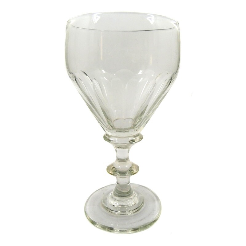 Goblet glass made of colorless glass with arched facets, pressed nodus, mid-19th century.