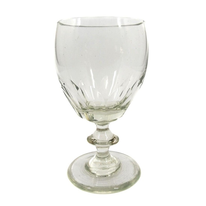 Goblet glass made of colorless glass with arched facets, pressed nodus, mid-19th century.
