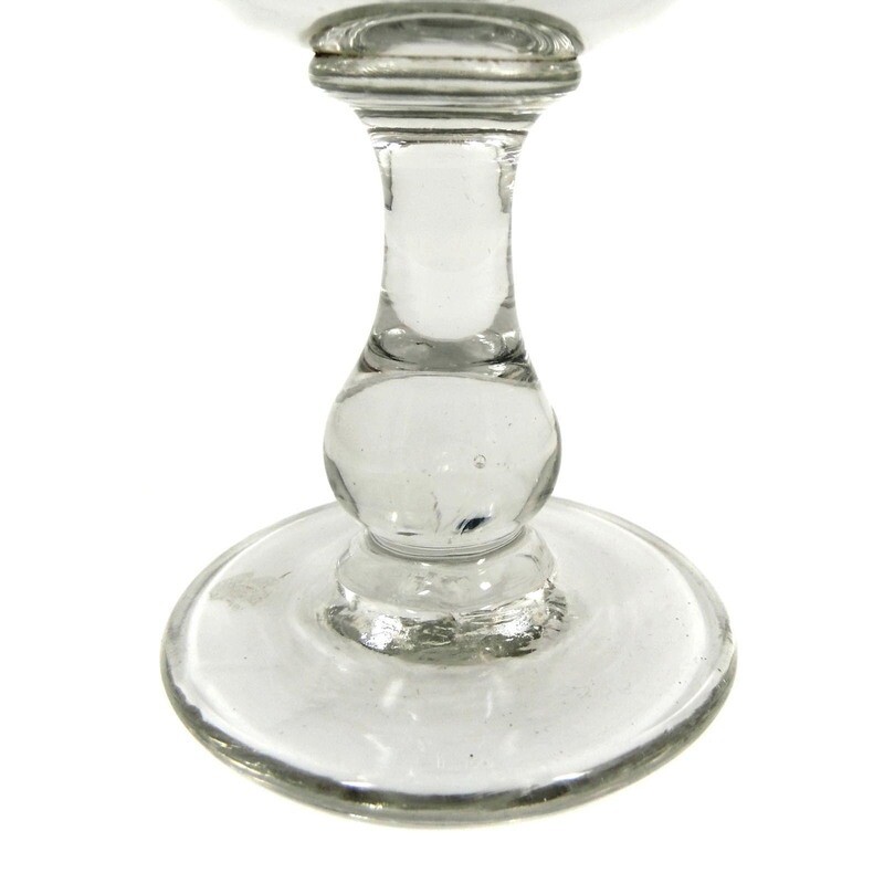 Southern wine glass made of colorless glass with baluster shaft &amp; arch facet, 19th century.