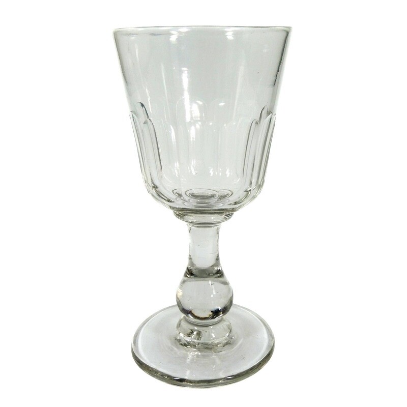 Southern wine glass made of colorless glass with baluster shaft &amp; arch facet, 19th century.