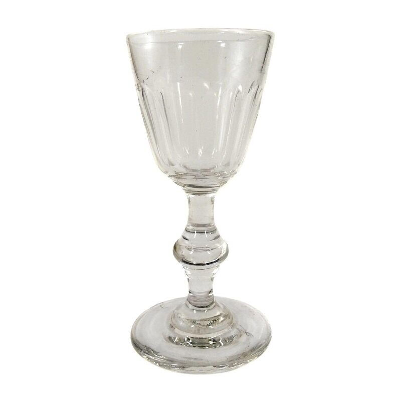 Shot glass made of colorless glass with arched facets and stepped nodus around 1870-80
