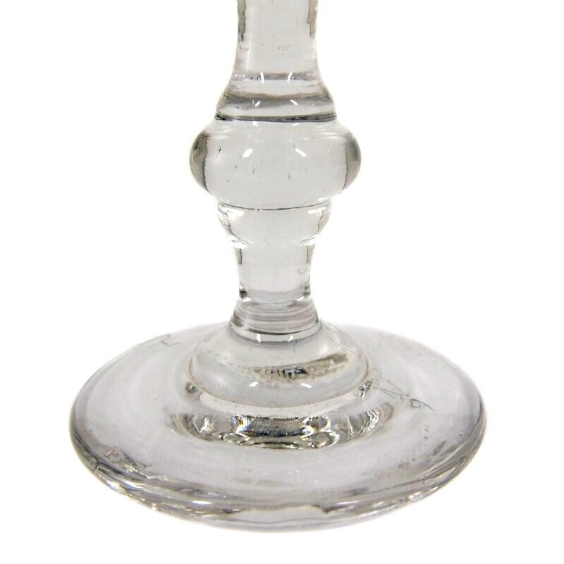 Shot glass made of colorless glass with arched facets and stepped nodus around 1870-80