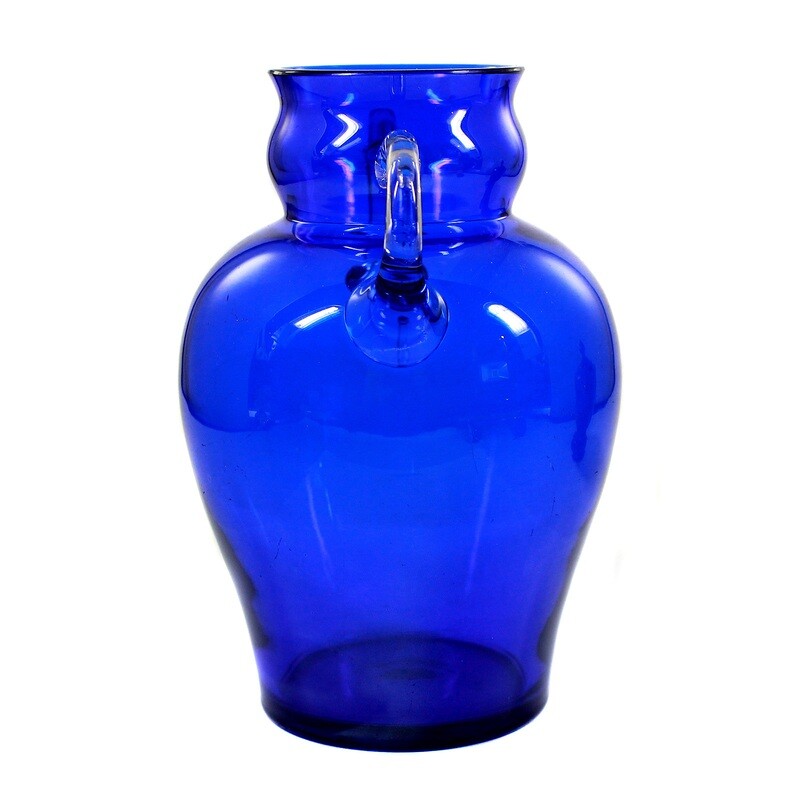 Vase made of colorless glass with a light blue base and attached handle, signed. J. Beck
