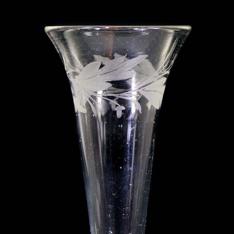 Champagne flute made of colorless glass with leaf border, North German around 1820